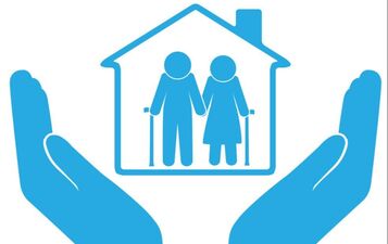 small image of two outlines of people in a home with hands underneath holding the home. image is in all blue